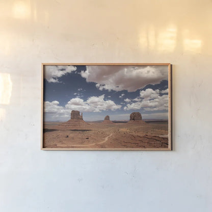 Monument Valley I by Debra Van Swearingen. shown as a paper print in a natural frame. Available as a archival giclee rolled canvas, fine art paper, or poster print. SKU 81265i.