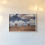 Monument Valley I by Debra Van Swearingen. shown as a paper print in a white frame. Available as a archival giclee rolled canvas, fine art paper, or poster print. SKU 81265i.