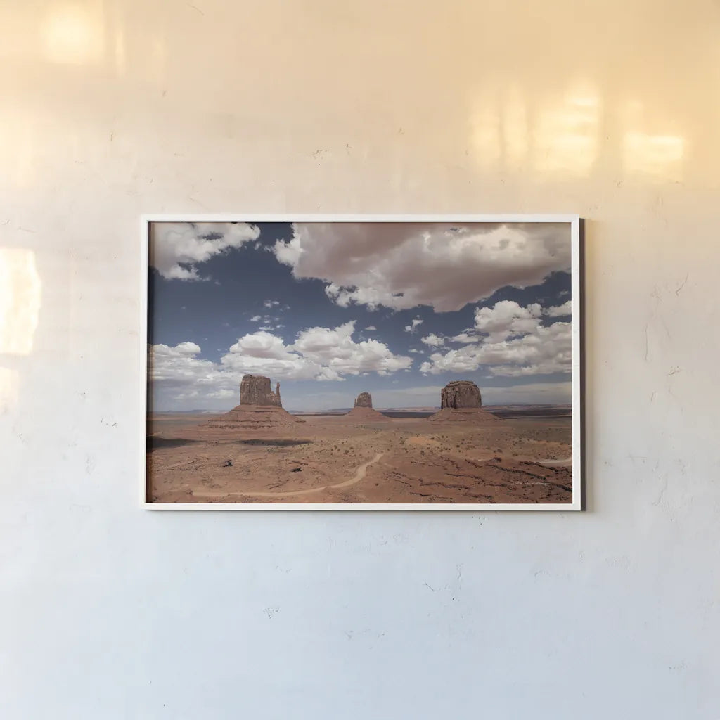 Monument Valley I by Debra Van Swearingen. shown as a paper print in a white frame. Available as a archival giclee rolled canvas, fine art paper, or poster print. SKU 81265i.