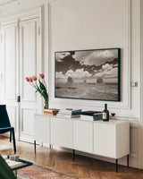 Monument Valley I Sepia by Debra Van Swearingen. shown as a framed stretched canvas in a living room above a console. Available as a archival giclee rolled canvas, fine art paper, or poster print. SKU 81269i.