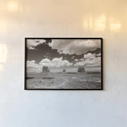 Monument Valley I Sepia by Debra Van Swearingen. shown as a paper print in a black flame. Available as a archival giclee rolled canvas, fine art paper, or poster print. SKU 81269i.