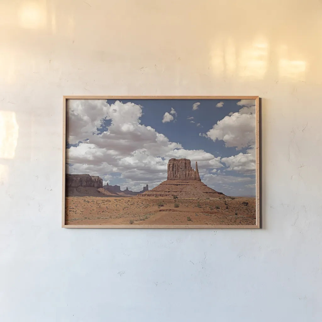 Monument Valley II by Debra Van Swearingen. shown as a paper print in a natural frame. Available as a archival giclee rolled canvas, fine art paper, or poster print. SKU 81266i.