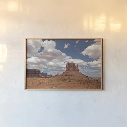 Monument Valley II by Debra Van Swearingen. shown as a paper print in a natural frame. Available as a archival giclee rolled canvas, fine art paper, or poster print. SKU 81266i.