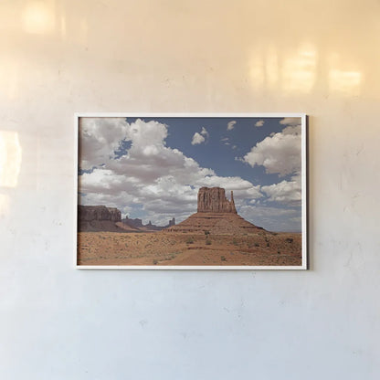 Monument Valley II by Debra Van Swearingen. shown as a paper print in a white frame. Available as a archival giclee rolled canvas, fine art paper, or poster print. SKU 81266i.