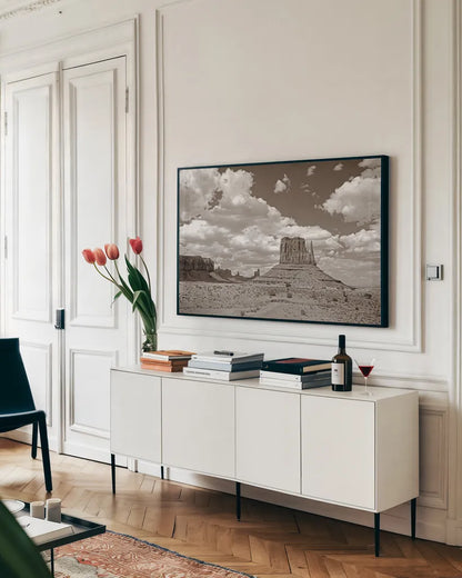 Monument Valley II Sepia by Debra Van Swearingen. shown as a framed stretched canvas in a living room above a console. Available as a archival giclee rolled canvas, fine art paper, or poster print. SKU 81270i.