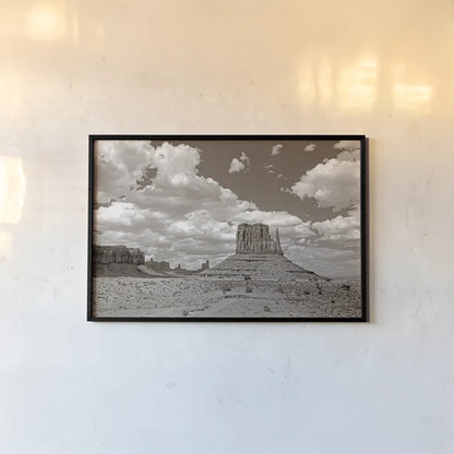 Monument Valley II Sepia by Debra Van Swearingen. shown as a paper print in a black flame. Available as a archival giclee rolled canvas, fine art paper, or poster print. SKU 81270i.