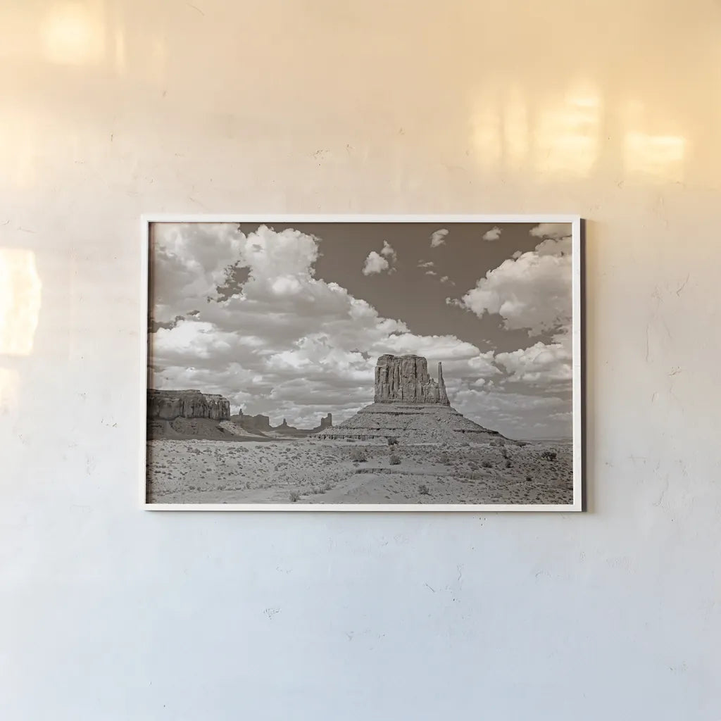 Monument Valley II Sepia by Debra Van Swearingen. shown as a paper print in a white frame. Available as a archival giclee rolled canvas, fine art paper, or poster print. SKU 81270i.
