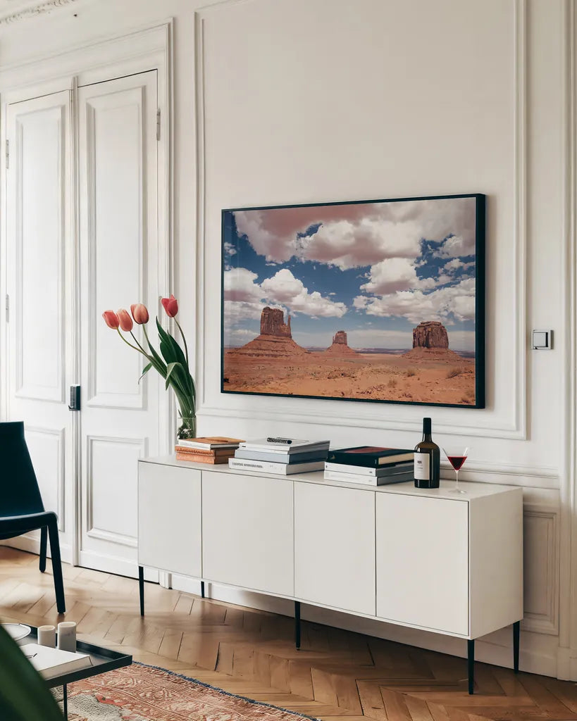 Monument Valley III by Debra Van Swearingen. shown as a framed stretched canvas in a living room above a console. Available as a archival giclee rolled canvas, fine art paper, or poster print. SKU 81267i.
