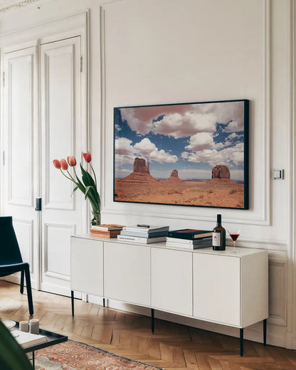 Monument Valley III by Debra Van Swearingen. shown as a framed stretched canvas in a living room above a console. Available as a archival giclee rolled canvas, fine art paper, or poster print. SKU 81267i.