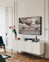 Monument Valley III Sepia by Debra Van Swearingen. shown as a framed stretched canvas in a living room above a console. Available as a archival giclee rolled canvas, fine art paper, or poster print. SKU 81271i.