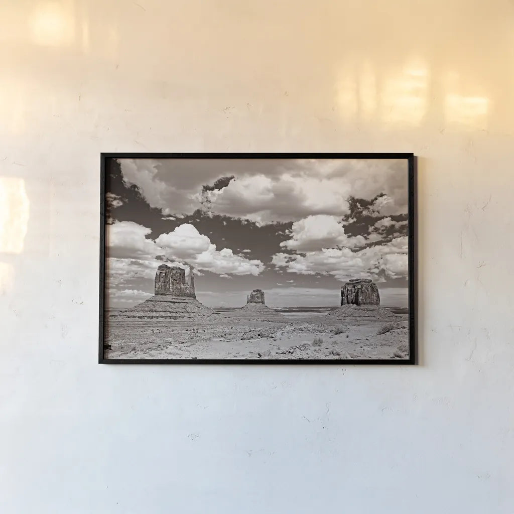 Monument Valley III Sepia by Debra Van Swearingen. shown as a paper print in a black flame. Available as a archival giclee rolled canvas, fine art paper, or poster print. SKU 81271i.