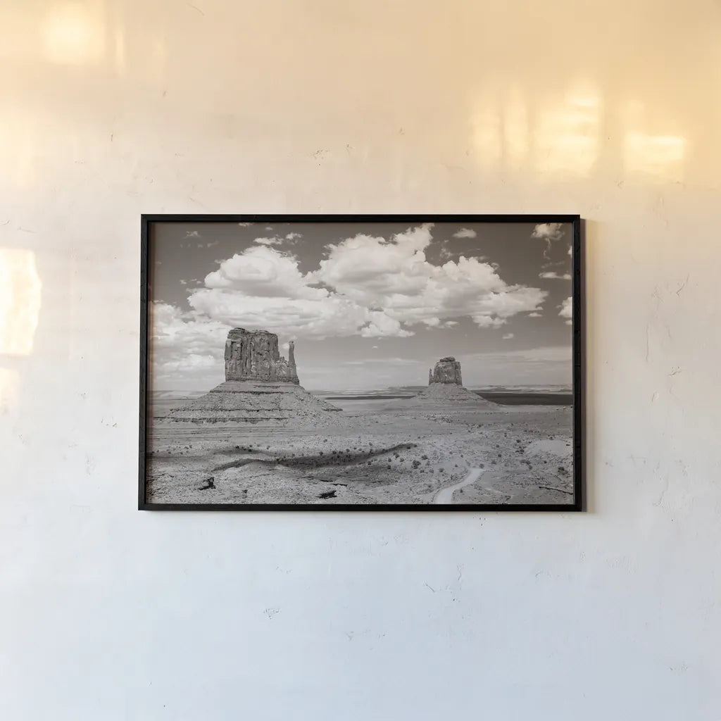 Monument Valley IV Sepia by Debra Van Swearingen. shown as a paper print in a black flame. Available as a archival giclee rolled canvas, fine art paper, or poster print. SKU 81272i.