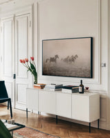 Paint Horses on the Run by Debra Van Swearingen. shown as a framed stretched canvas in a living room above a console. Available as a archival giclee rolled canvas, fine art paper, or poster print. SKU 59412i.