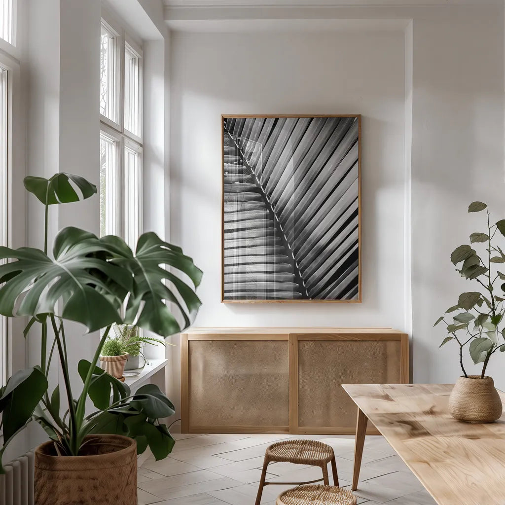 Palm Frond I by Debra Van Swearingen. shown as a print in a natural wood frame in a dining room. Available as a archival giclee rolled canvas, fine art paper, or poster print. SKU 42488h.