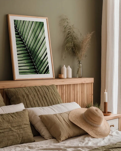 Palm Frond I Green by Debra Van Swearingen. shown as a paper print in a natural frame. Available as a archival giclee rolled canvas, fine art paper, or poster print. SKU 66128h.