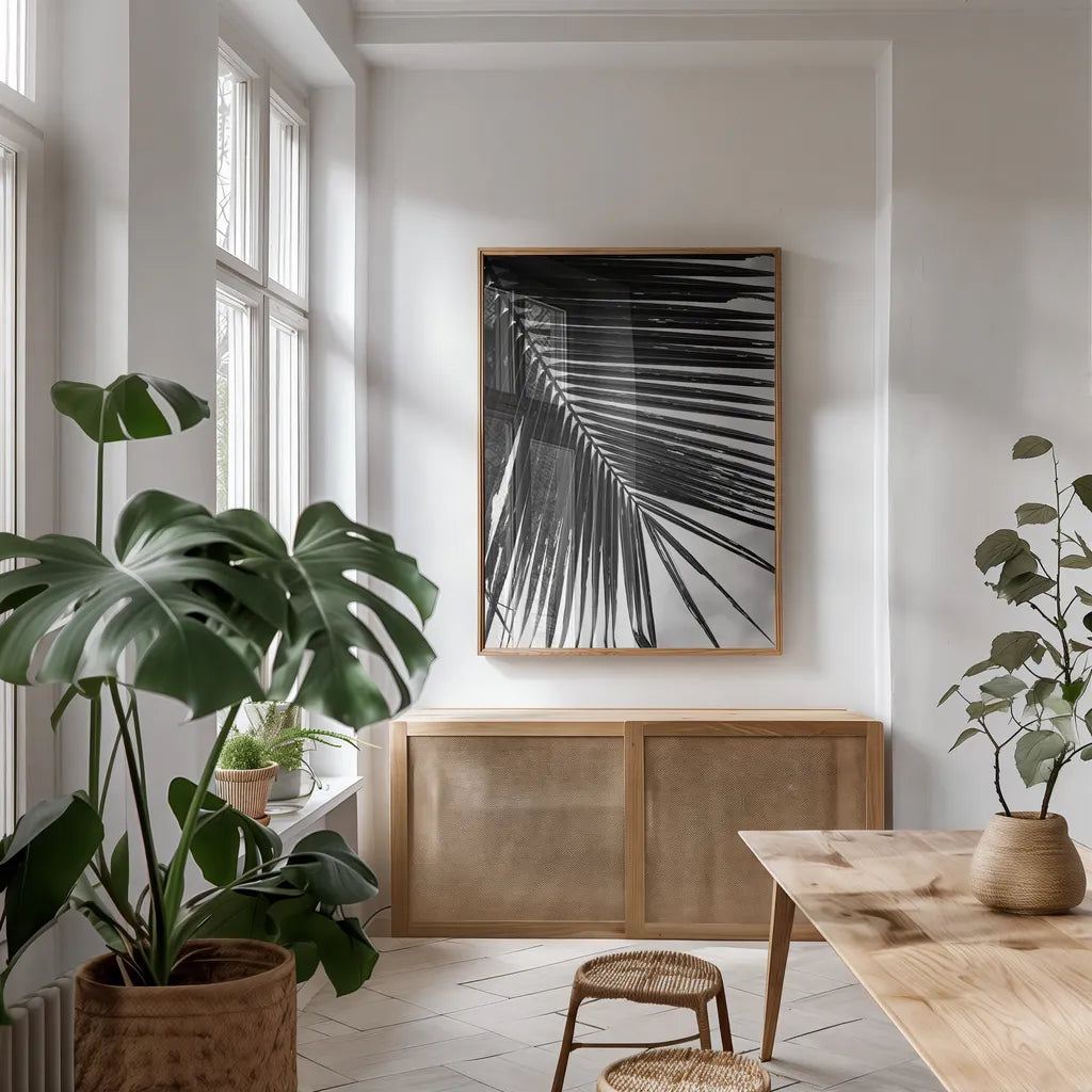 Palm Frond II by Debra Van Swearingen. shown as a print in a natural wood frame in a dining room. Available as a archival giclee rolled canvas, fine art paper, or poster print. SKU 42489h.