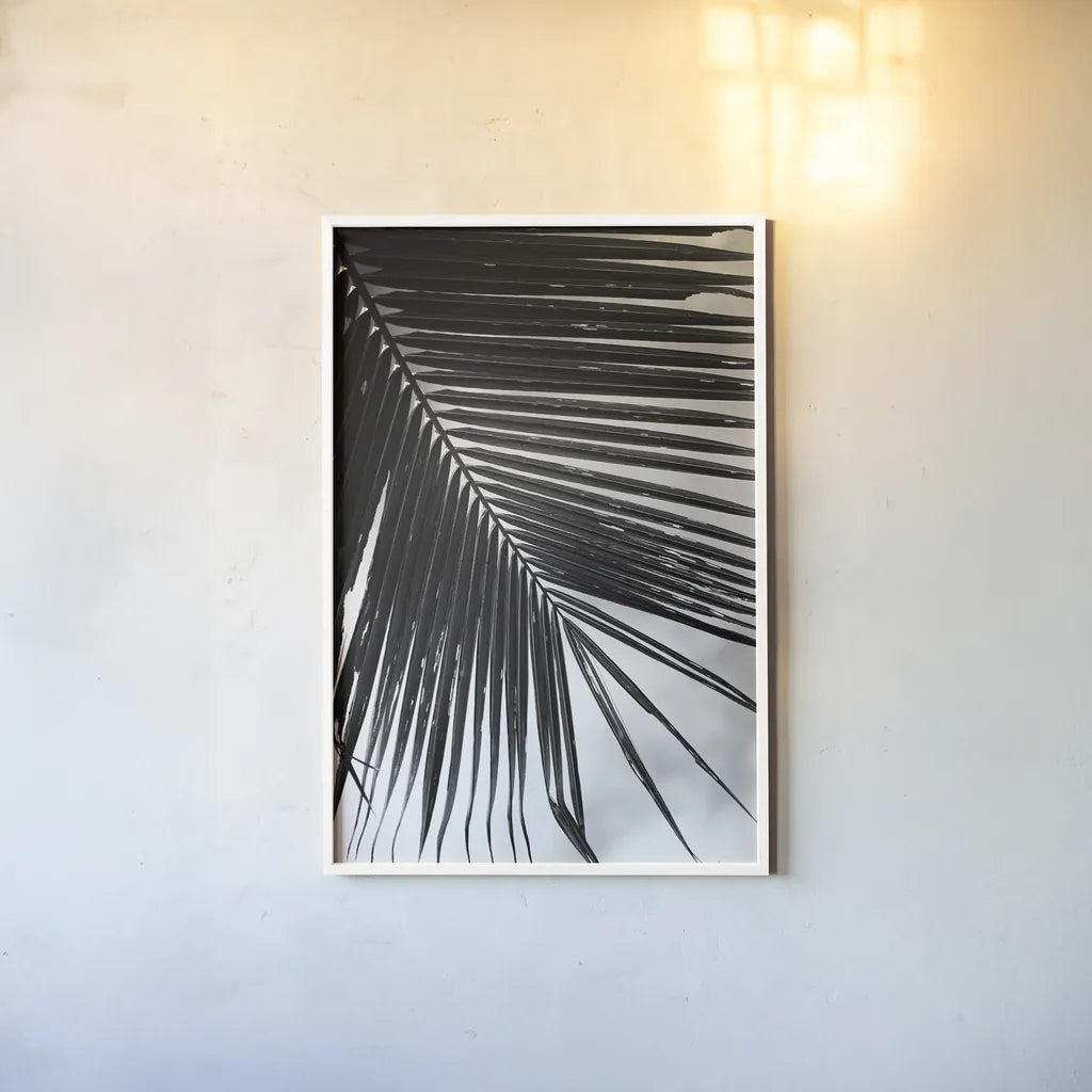 Palm Frond II by Debra Van Swearingen. shown as a paper print in a white frame. Available as a archival giclee rolled canvas, fine art paper, or poster print. SKU 42489h.