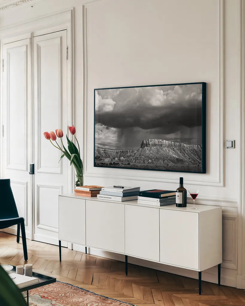 Storms on the Mesa by Debra Van Swearingen. shown as a framed stretched canvas in a living room above a console. Available as a archival giclee rolled canvas, fine art paper, or poster print. SKU 19412i.