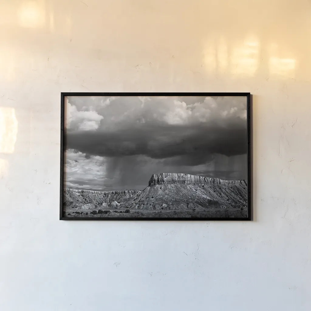 Storms on the Mesa by Debra Van Swearingen. shown as a paper print in a black flame. Available as a archival giclee rolled canvas, fine art paper, or poster print. SKU 19412i.
