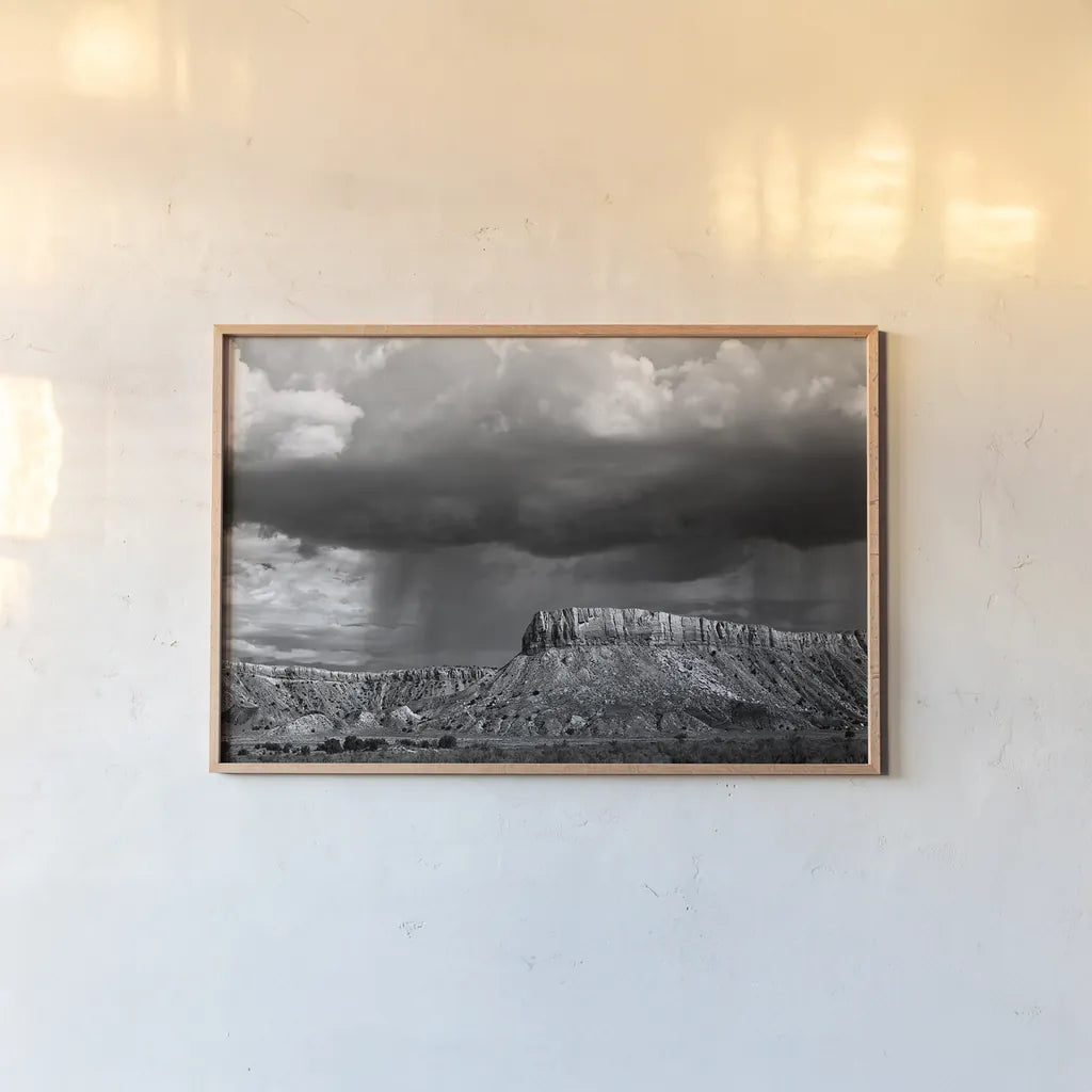 Storms on the Mesa by Debra Van Swearingen. shown as a paper print in a natural frame. Available as a archival giclee rolled canvas, fine art paper, or poster print. SKU 19412i.