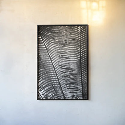 Sunlit Palms I by Debra Van Swearingen. shown as a paper print in a black flame. Available as a archival giclee rolled canvas, fine art paper, or poster print. SKU 81257h.