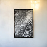Sunlit Palms II by Debra Van Swearingen. shown as a paper print in a black flame. Available as a archival giclee rolled canvas, fine art paper, or poster print. SKU 81258h.