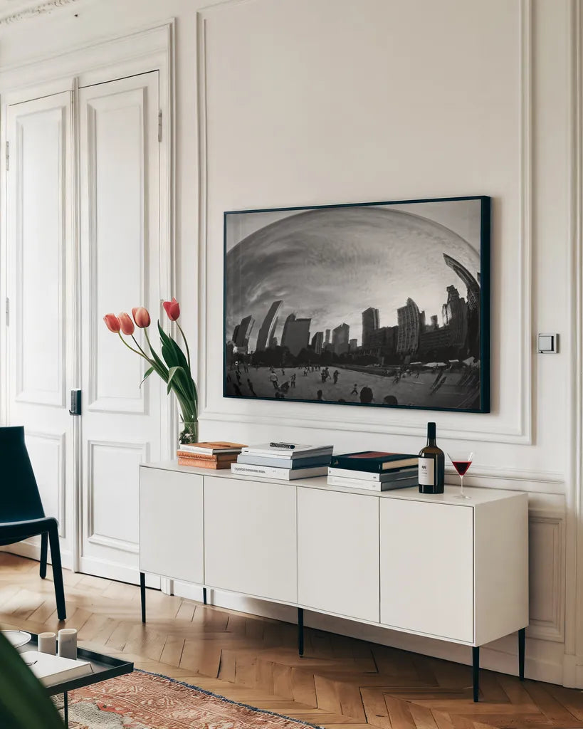 The Bean Chicago BW by Debra Van Swearingen. shown as a framed stretched canvas in a living room above a console. Available as a archival giclee rolled canvas, fine art paper, or poster print. SKU 55175i.