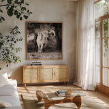 Three Wild Horses Sepia Crop by Debra Van Swearingen. Shown in a natural wood frame in a cozy modern living room. Available as an archival giclee rolled canvas, fine art paper, or poster print. SKU 52847a.