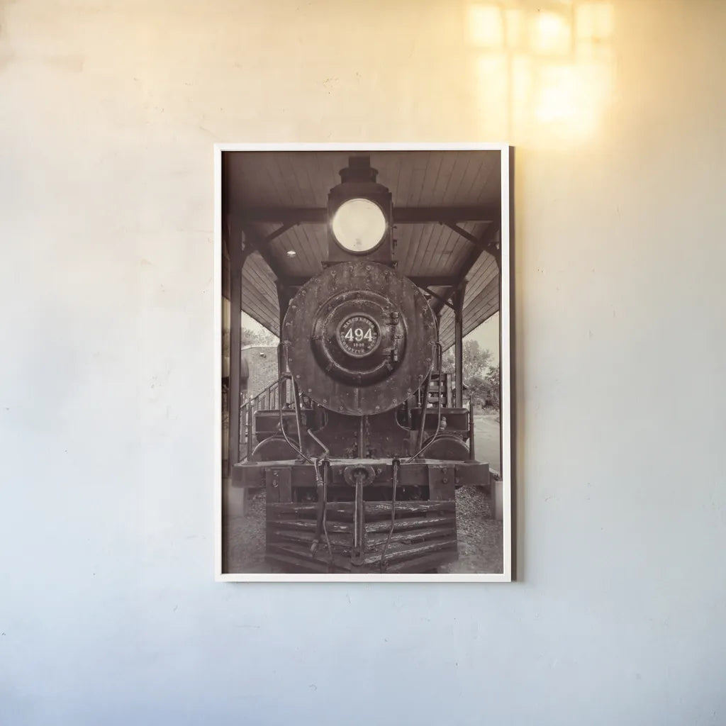 Vintage Train I Sepia by Debra Van Swearingen. shown as a paper print in a white frame. Available as a archival giclee rolled canvas, fine art paper, or poster print. SKU 88466h.