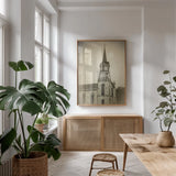 Wooden Steeple by Debra Van Swearingen. shown as a print in a natural wood frame in a dining room. Available as a archival giclee rolled canvas, fine art paper, or poster print. SKU 88675h.