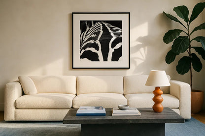 Zebra V by Debra Van Swearingen. Displayed in a glass frame with matte in a clean modern living room. Available as an archival giclee rolled canvas, fine art paper, or poster print. SKU 48737a.