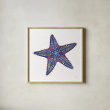Along the Coast Starfish I by Dina June. Shown in a natural wood glass frame for a timeless modern aesthetic. Available as an archival giclee rolled canvas, fine art paper, or poster print. SKU 86006a.