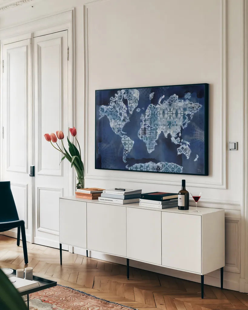 Indigo Splash I by Dina June. shown as a framed stretched canvas in a living room above a console. Available as a archival giclee rolled canvas, fine art paper, or poster print. SKU 71920i.