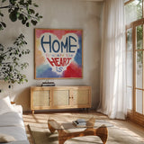 Rainbow Love II by Dina June. Shown in a natural wood frame in a cozy modern living room. Available as an archival giclee rolled canvas, fine art paper, or poster print. SKU 74226a.