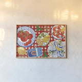 Tabletop I by Dina June. shown as a paper print in a natural frame. Available as a archival giclee rolled canvas, fine art paper, or poster print. SKU 104478i.