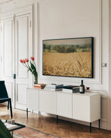 Blissful Country I by Elizabeth Urquhart. shown as a framed stretched canvas in a living room above a console. Available as a archival giclee rolled canvas, fine art paper, or poster print. SKU 23774i.