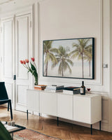 By the Sea I by Elizabeth Urquhart. shown as a framed stretched canvas in a living room above a console. Available as a archival giclee rolled canvas, fine art paper, or poster print. SKU 50749i.
