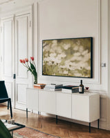 Daisies I by Elizabeth Urquhart. shown as a framed stretched canvas in a living room above a console. Available as a archival giclee rolled canvas, fine art paper, or poster print. SKU 24293i.