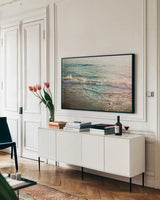 First Light II by Elizabeth Urquhart. shown as a framed stretched canvas in a living room above a console. Available as a archival giclee rolled canvas, fine art paper, or poster print. SKU 25507i.