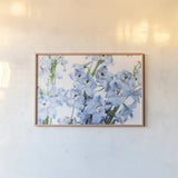 Freshly Picked Delphinium I by Elizabeth Urquhart. shown as a paper print in a natural frame. Available as a archival giclee rolled canvas, fine art paper, or poster print. SKU 67966i.
