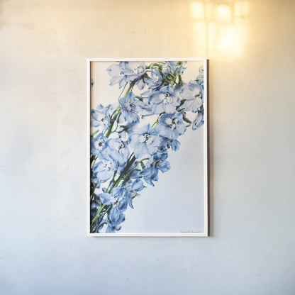 Freshly Picked Delphinium IV by Elizabeth Urquhart. shown as a paper print in a white frame. Available as a archival giclee rolled canvas, fine art paper, or poster print. SKU 67969h.