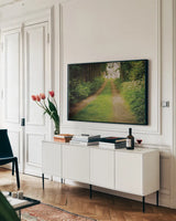 Going Home by Elizabeth Urquhart. shown as a framed stretched canvas in a living room above a console. Available as a archival giclee rolled canvas, fine art paper, or poster print. SKU 10474i.