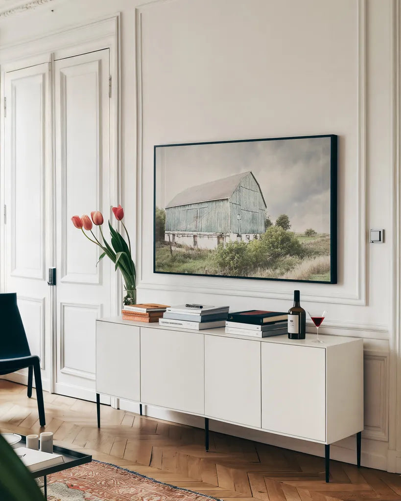 Late Summer Barn I Crop by Elizabeth Urquhart. shown as a framed stretched canvas in a living room above a console. Available as a archival giclee rolled canvas, fine art paper, or poster print. SKU 30333i.