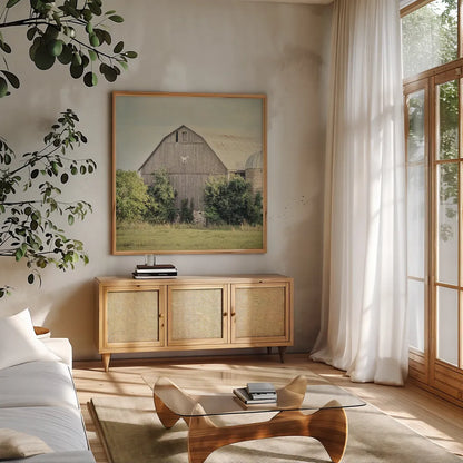Late Summer Barn II Crop by Elizabeth Urquhart. Shown in a natural wood frame in a cozy modern living room. Available as an archival giclee rolled canvas, fine art paper, or poster print. SKU 30334a.
