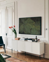 Leafy VI by Elizabeth Urquhart. shown as a framed stretched canvas in a living room above a console. Available as a archival giclee rolled canvas, fine art paper, or poster print. SKU 50723i.