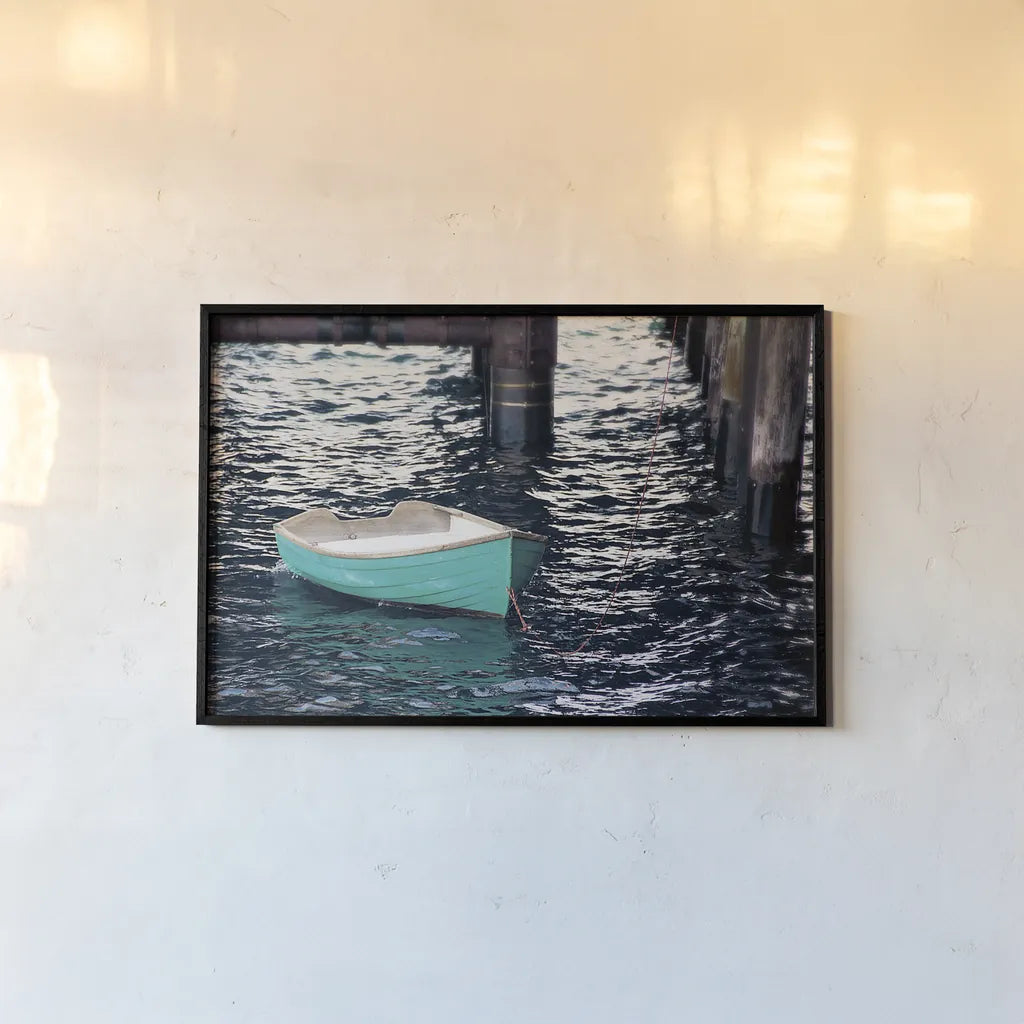 Rowboat II by Elizabeth Urquhart. shown as a paper print in a black flame. Available as a archival giclee rolled canvas, fine art paper, or poster print. SKU 22326i.