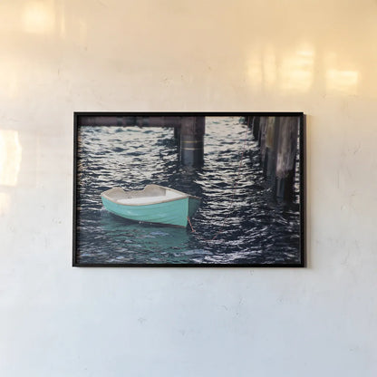 Rowboat II by Elizabeth Urquhart. shown as a paper print in a black flame. Available as a archival giclee rolled canvas, fine art paper, or poster print. SKU 22326i.