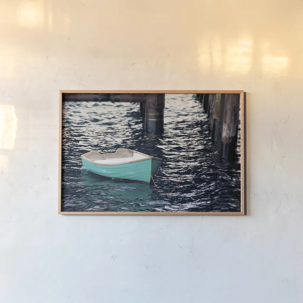 Rowboat II by Elizabeth Urquhart. shown as a paper print in a natural frame. Available as a archival giclee rolled canvas, fine art paper, or poster print. SKU 22326i.