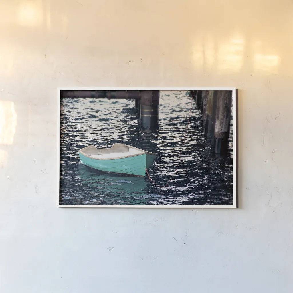 Rowboat II by Elizabeth Urquhart. shown as a paper print in a white frame. Available as a archival giclee rolled canvas, fine art paper, or poster print. SKU 22326i.