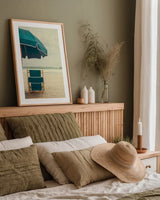 Under the Umbrella II by Elizabeth Urquhart. shown as a paper print in a natural frame. Available as a archival giclee rolled canvas, fine art paper, or poster print. SKU 33207h.